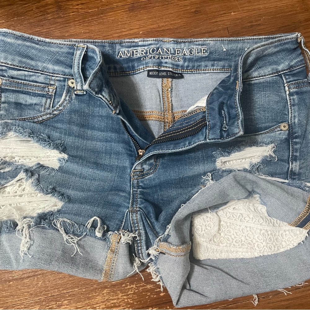 American Eagle Outfitters Blue Distressed Jeans with White Lace Pockets